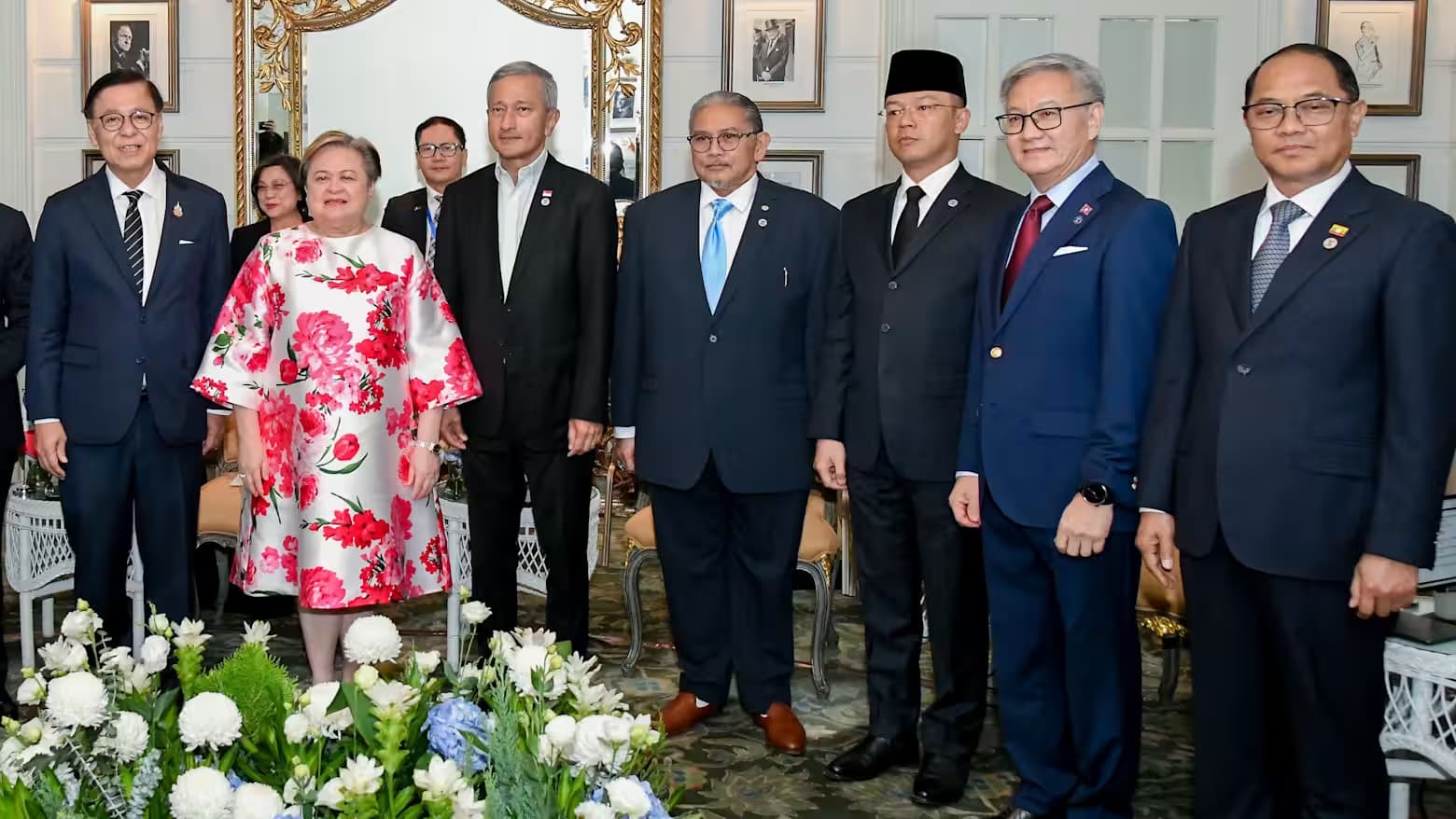 ASEAN foreign ministers pose for a group photo at an informal meeting in Bangkok