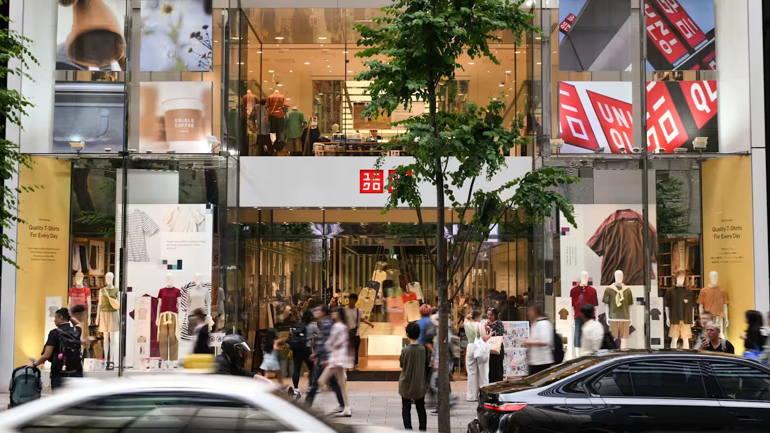 Shoppers pass the Uniqlo flagship store in Tokyo