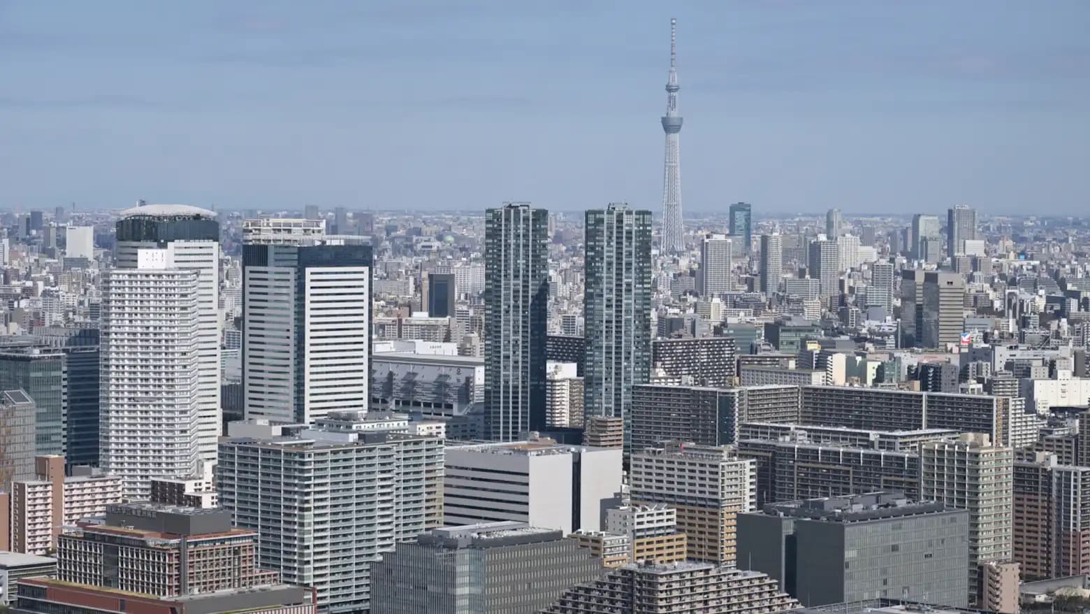 Aerial view of the Tokyo skyline with Tokyo Skytree visible in the distance