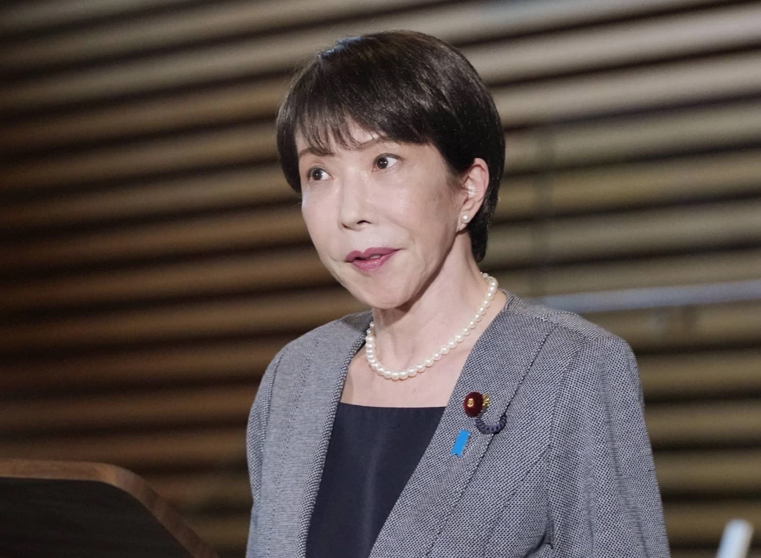Japanese Prime Minister Sanae Takaichi speaking to reporters
